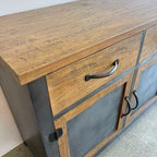 Close-up of mango wood grain, brushed steel and dark metal detailing on the Barber 2 Door Sideboard