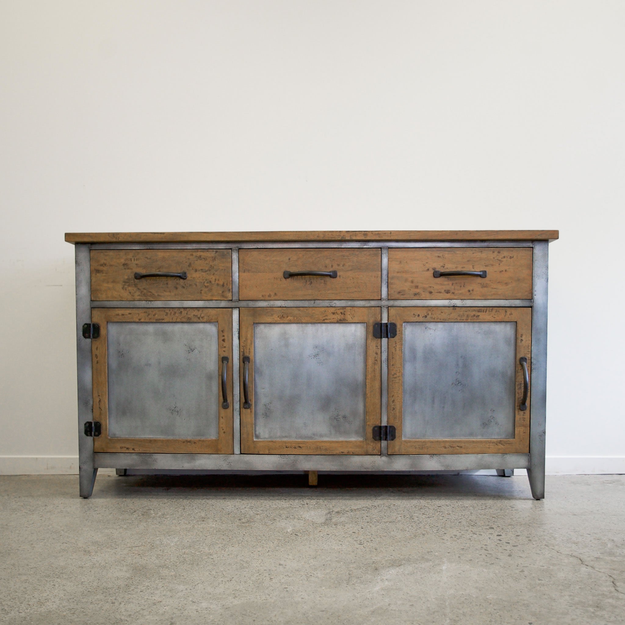 Front view of Barber 3 Door Sideboard in mango wood with brushed steel doors and three drawers