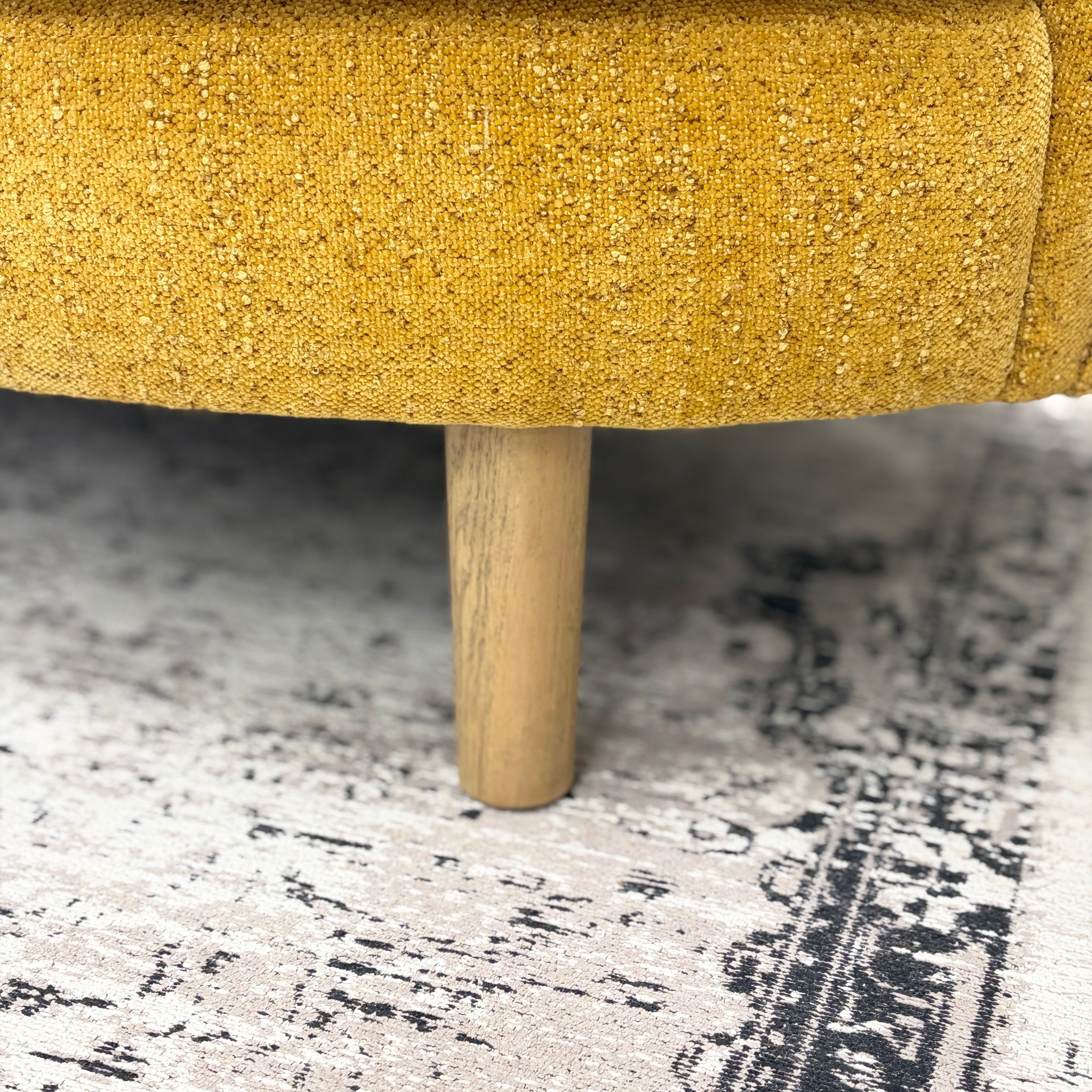 Close-up of the Bardot Sofa's solid timber leg and upholstered frame, highlighting quality craftsmanship and contemporary styling.