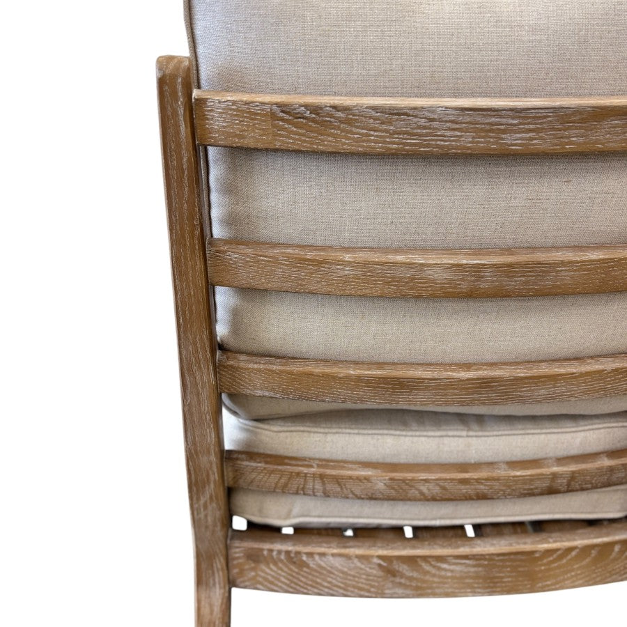 Close-up of the Cameron Chair's upholstered backrest, showcasing the curved design and quality linen blend fabric.