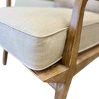 Close-up of the Cameron Chair's solid timber frame and natural linen blend upholstery, highlighting the quality craftsmanship and fabric texture.
