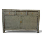 Distressed Cass sage grey timber sideboard with three drawers and two doors in studio