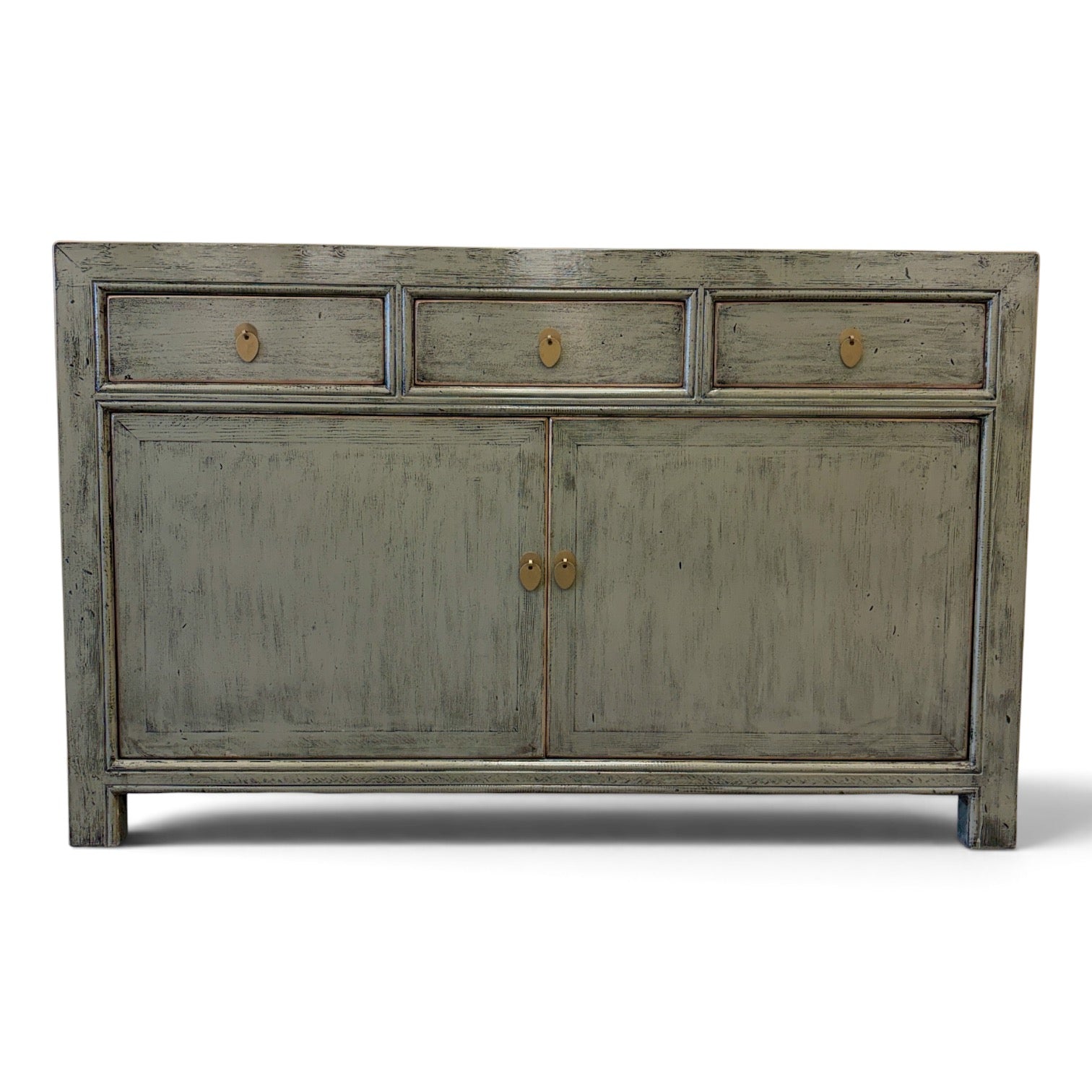 Distressed Cass sage grey timber sideboard with three drawers and two doors in studio