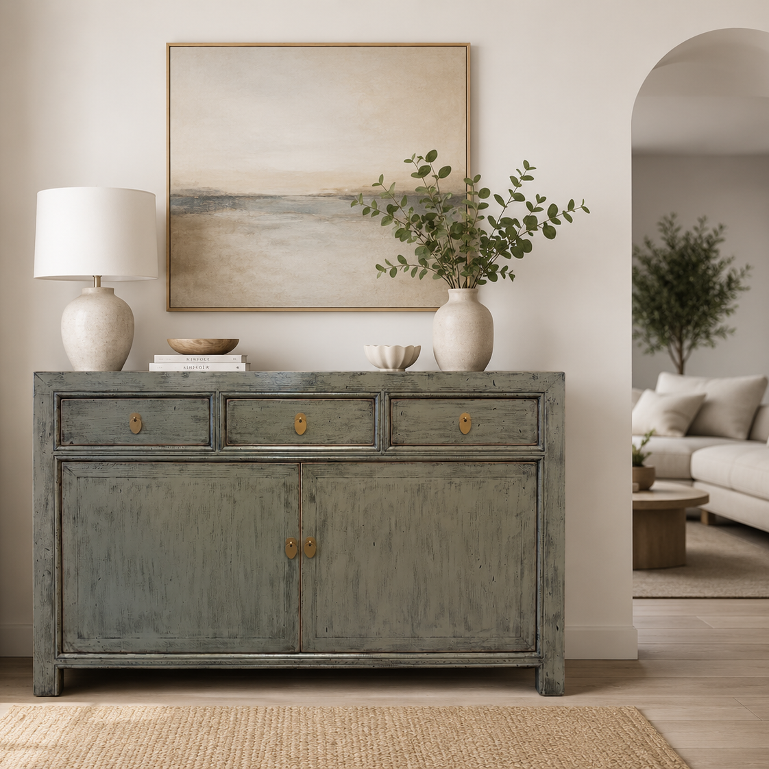 Cass Sideboard in Sage Grey styled in a living room with artwork and décor