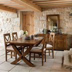 Chateau Leg Extension Dining Table crafted from solid mango wood, styled in a rustic dining room.