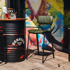 The Datsun Bar Stool styled in a contemporary café setting, demonstrating its versatile industrial-inspired design.