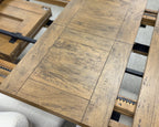 Close-up of the Double Leaf Extension Table's solid mango wood extension leaves, highlighting the matching timber grain and rustic finish.