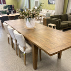 Styled view of the Double Leaf Extension Table in a contemporary dining setting, showcasing the solid mango wood construction and rustic timber finish.