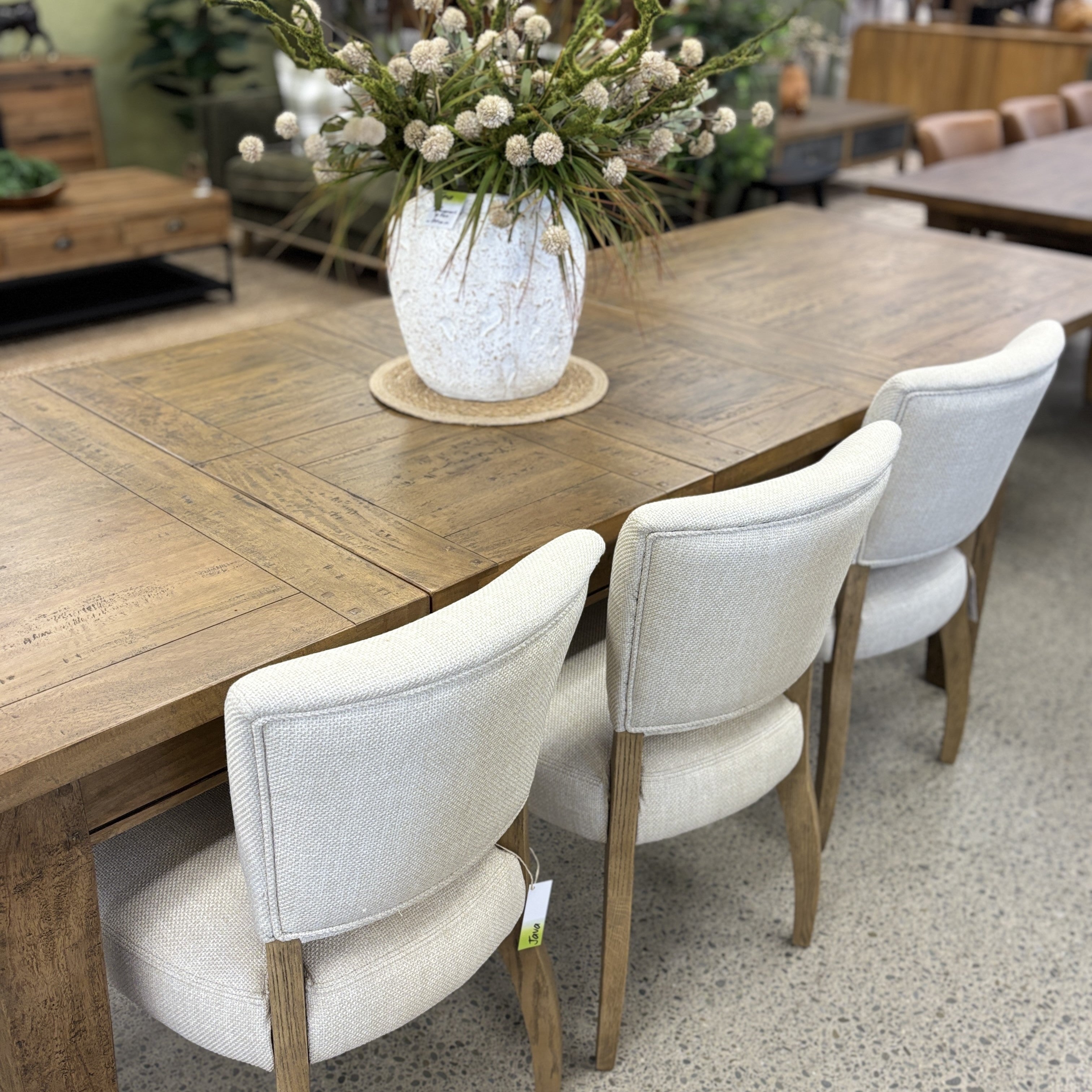 The Double Leaf Extension Table paired with upholstered dining chairs, demonstrating its generous proportions and versatile everyday dining style.