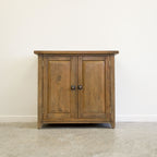 Front view of Driftwood Cupboard with two timber doors and dark metal handles
