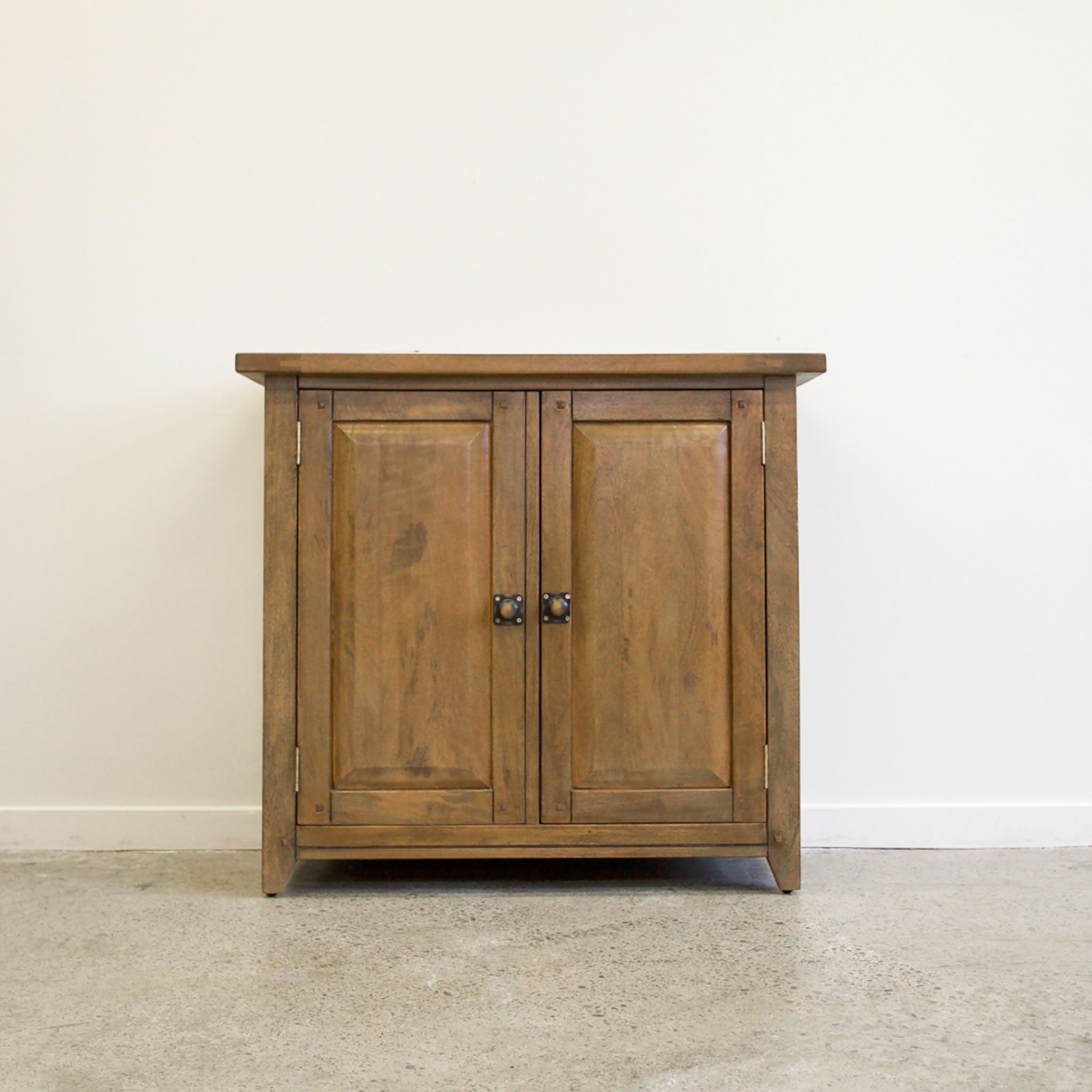 Front view of Driftwood Cupboard with two timber doors and dark metal handles