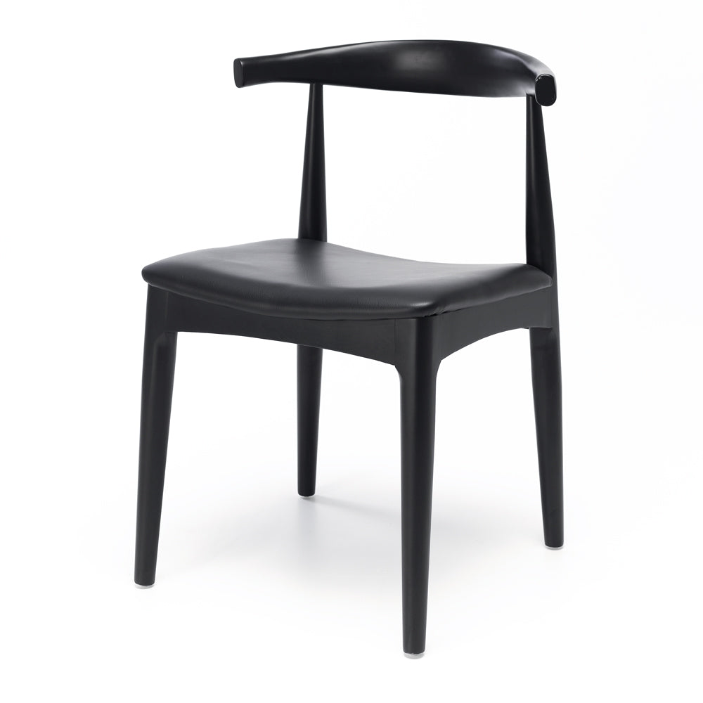 Black Elbow Dining Chair angled view showing sculpted curved back and black PU seat