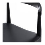 Close up of Elbow Dining Chair Black showing black oak finish and curved timber frame