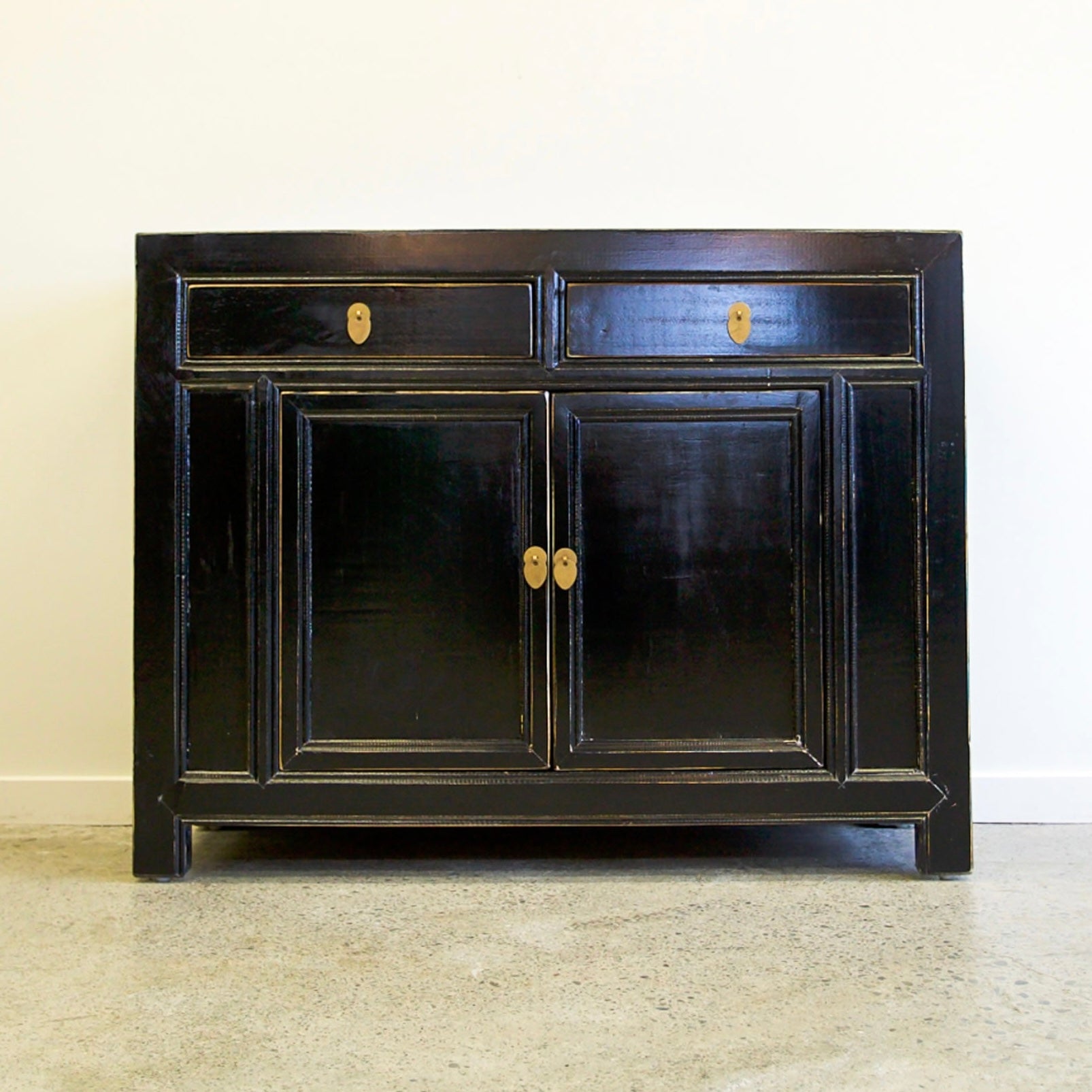 Elliot Sideboard Black with two drawers, panelled cupboard doors and brass toned handles