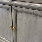 Elliot Sideboard Glossy Grey showing panelled cupboard doors and brass toned handles