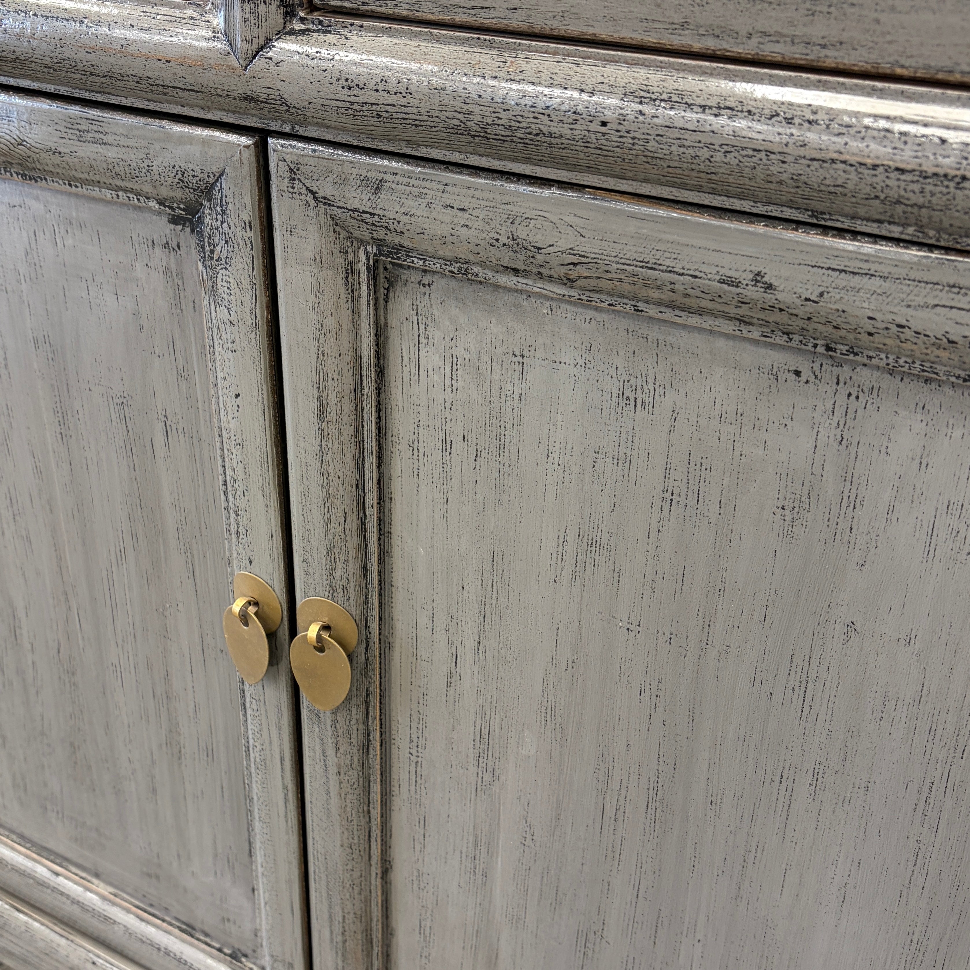 Elliot Sideboard Glossy Grey showing panelled cupboard doors and brass toned handles