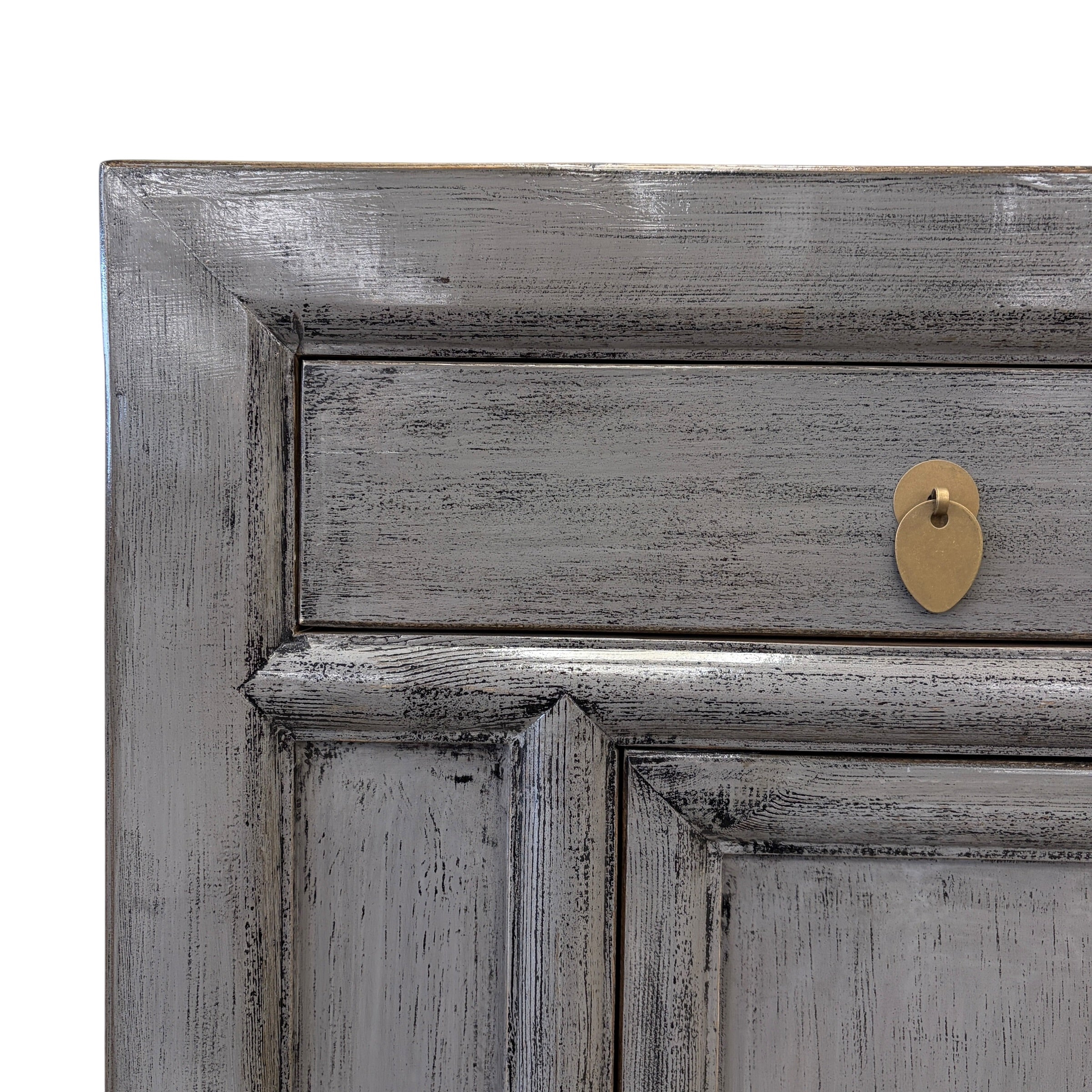 Close up of Elliot Sideboard Glossy Grey drawer showing textured finish and brass toned handle