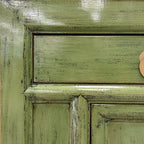 Close up of Elliot Sideboard showing textured olive green finish and brass toned hardware