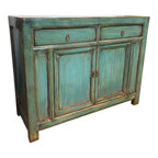 Angled view of the Elliot Sideboard in distressed sea green with two drawers and cupboard storage