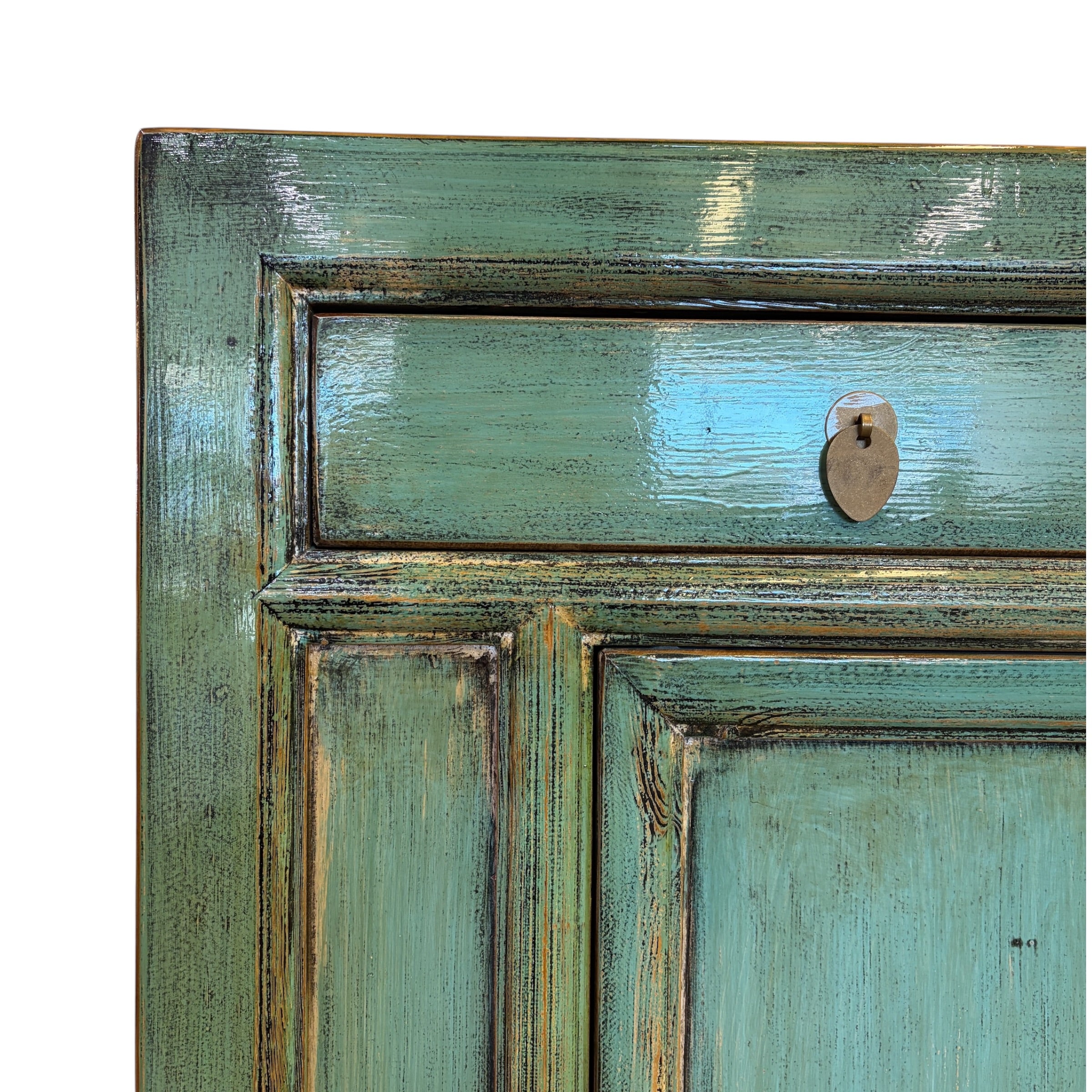 Close-up of the Elliot Sideboard drawer showing the aged sea green finish and metal knob
