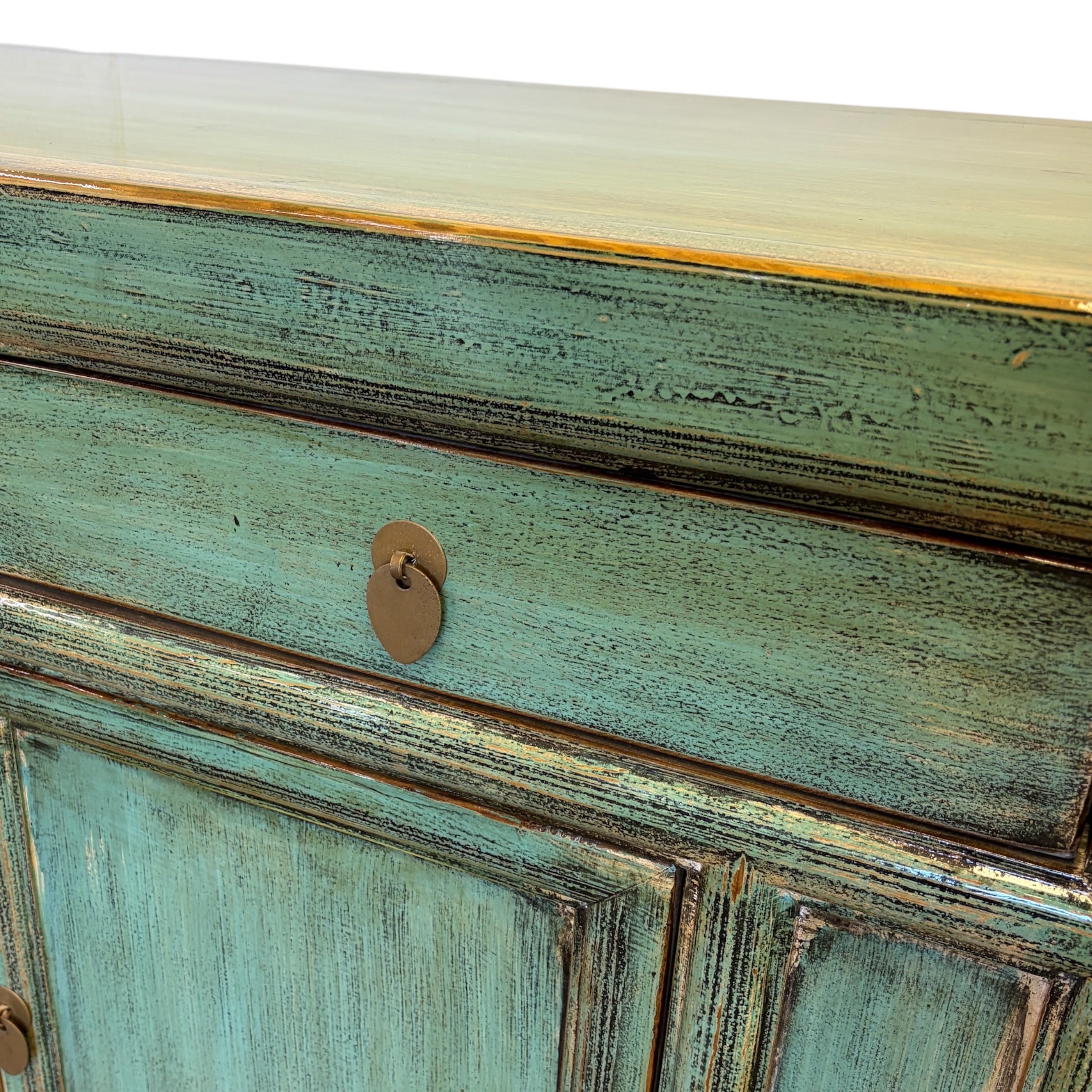 Close-up of the textured distressed sea green finish and drawer detail on the Elliot Sideboard