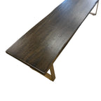 Evolution mango wood bench showing rustic free form edge and gold iron leg