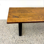 Close-up of the Evolution Albany bench seat showing the mango wood grain and black iron frame