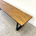 Close-up of the Evolution bench seat showing the natural grain and character of the Albany mango wood