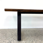 Side profile of the Evolution Albany bench seat showing the mango wood seat and black iron leg
