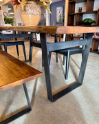 End view of the Evolution Rectangular Dining Table in Albany, highlighting the solid mango wood construction and sculptural base.