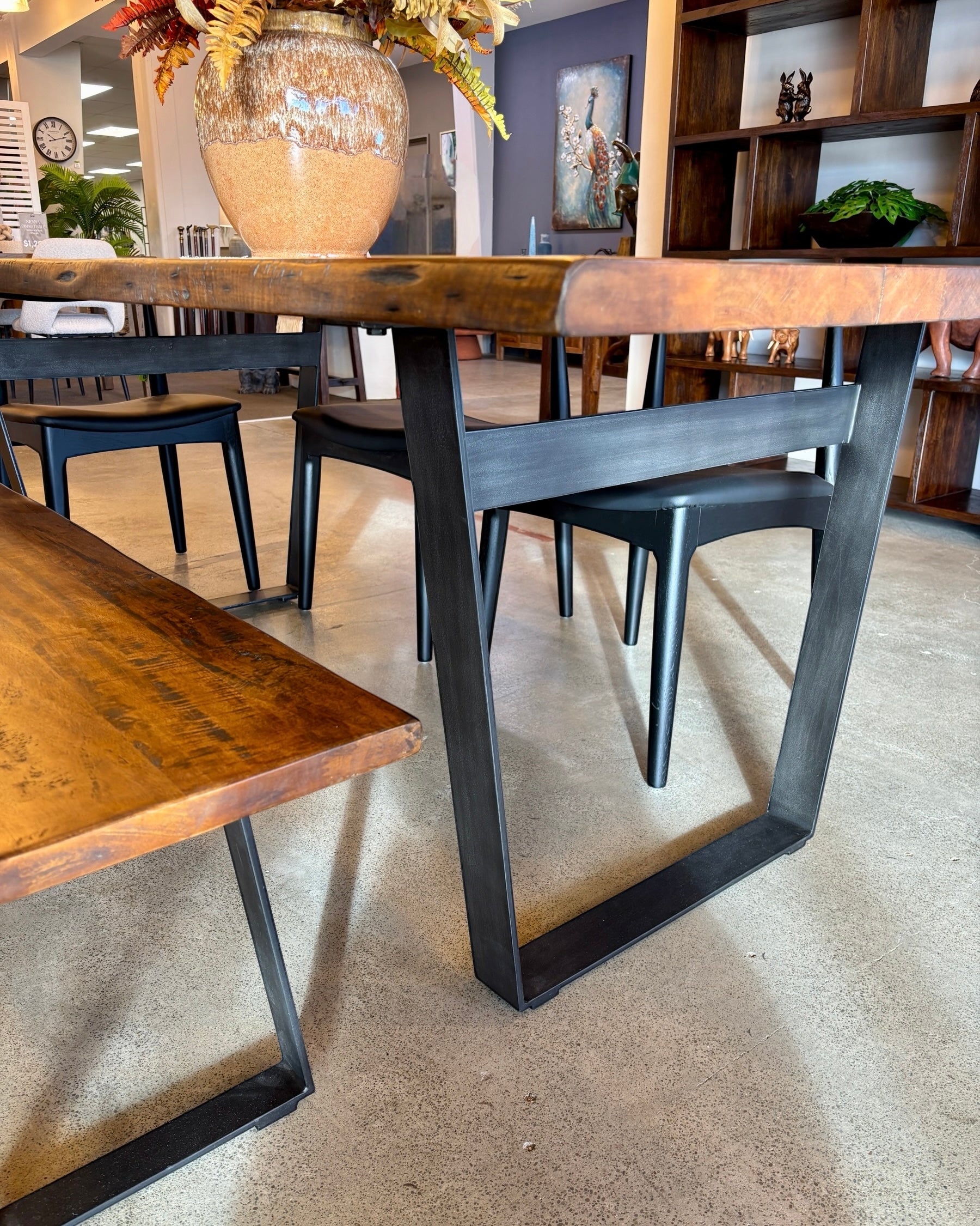 End view of the Evolution Rectangular Dining Table in Albany, highlighting the solid mango wood construction and sculptural base.