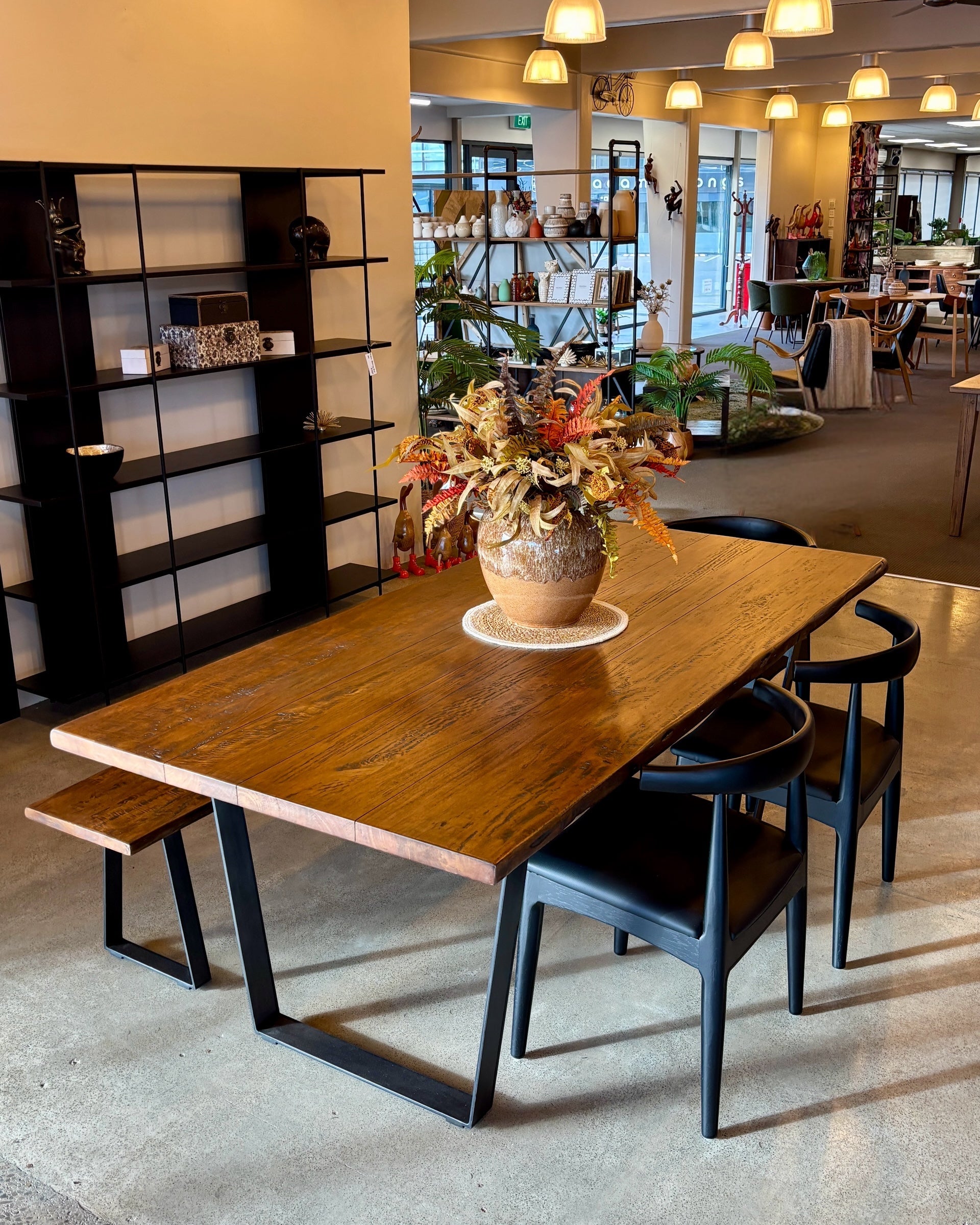 Evolution Rectangular Dining Table in Albany styled in a dining setting, showcasing its solid mango wood construction, freeform edge and contemporary design.