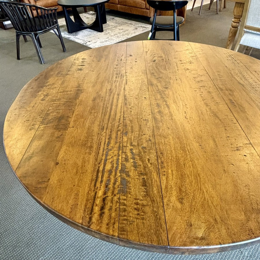 Top view of the Evolution Round Dining Table in Albany, showcasing the solid mango wood tabletop and distinctive rustic grain.