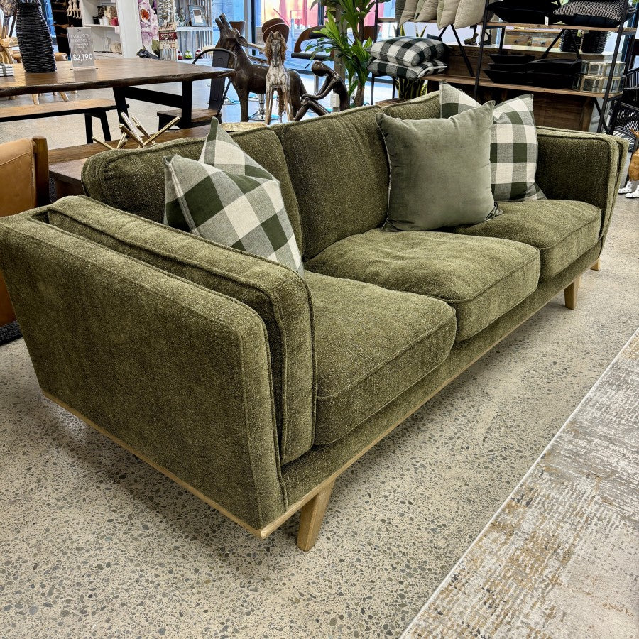 Fergus 3 Seat Sofa in Plush Olive styled in a contemporary living room with complementary furniture and décor.