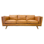 Fergus Sofa in Toffee leather with clean contemporary lines, premium leather upholstery and solid oak legs.
