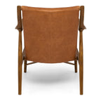 Rear view of the Finn Occasional Chair in Tan, highlighting its sculpted solid ash timber frame and premium aniline leather upholstery.