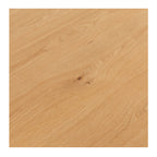 Close-up of the Flow Dining Table's solid oak tabletop, highlighting the natural timber grain and protective matt finish.