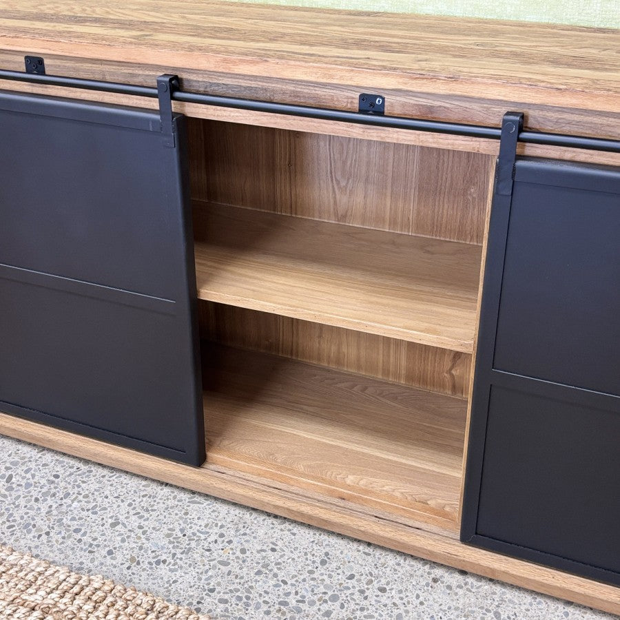 Forged Iron Sideboard with sliding iron doors open to reveal internal timber shelving