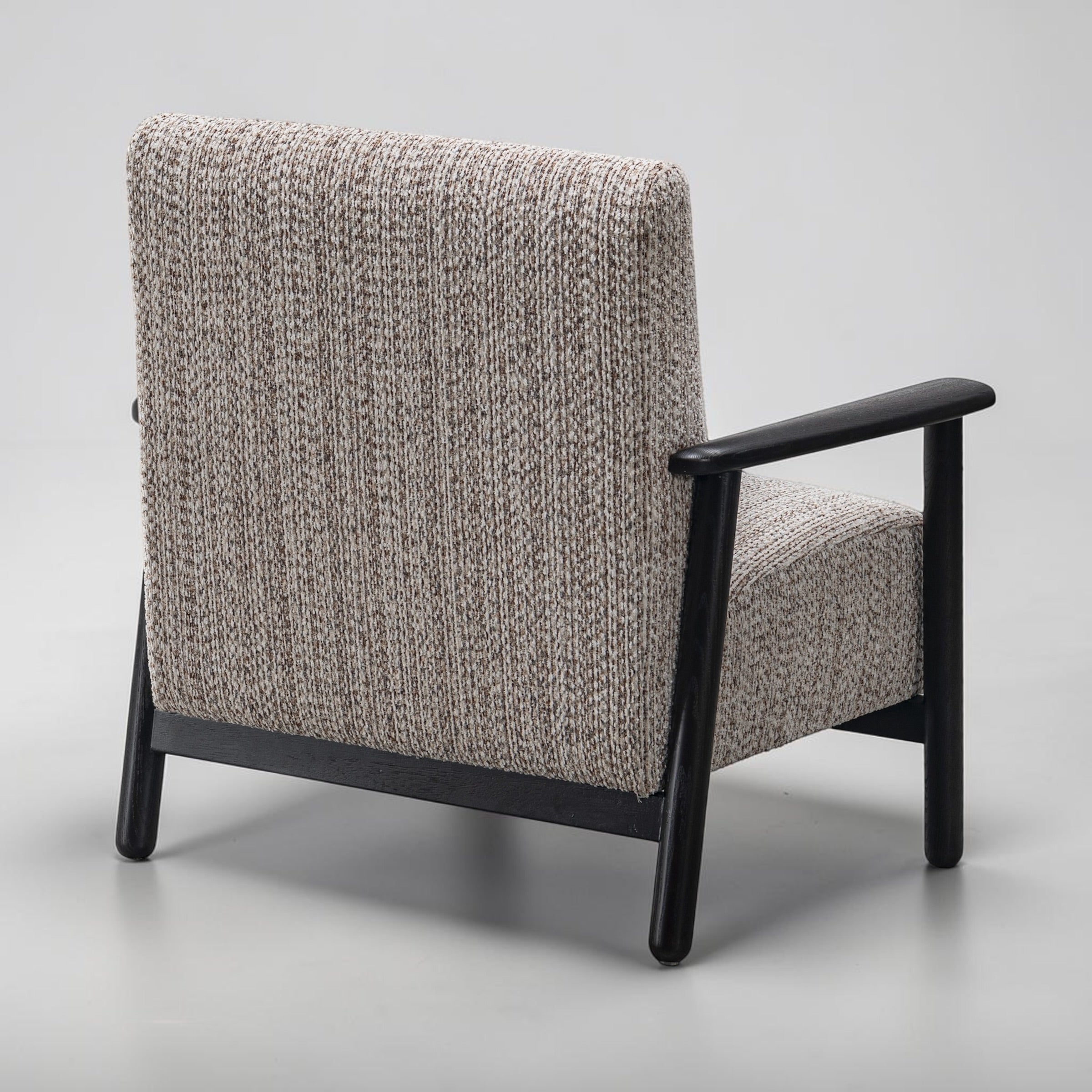 Rear view of the Frankie chair in Nutmeg Cream, highlighting its curved back and quality upholstery.