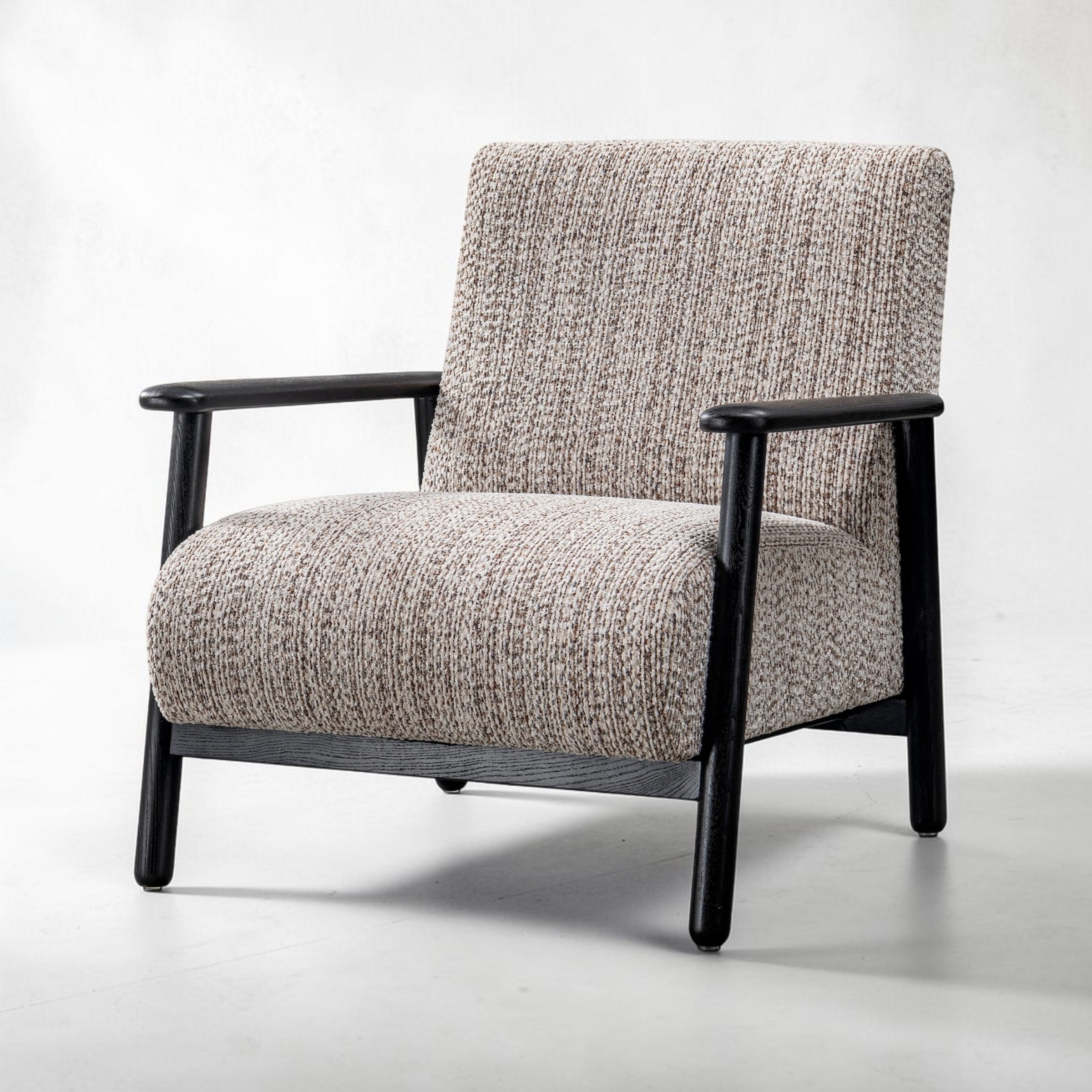 Side profile of the Frankie chair in Nutmeg Cream with supportive cushioning and modern styling.