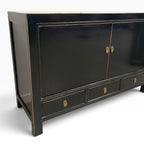 Frano Sideboard in black showing brass handles and subtle distressed detailing
