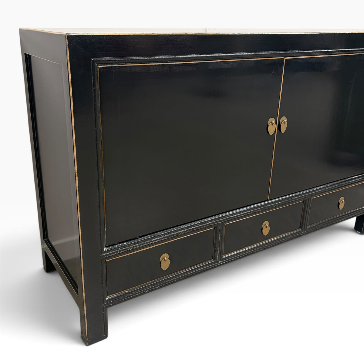 Frano Sideboard in black showing brass handles and subtle distressed detailing