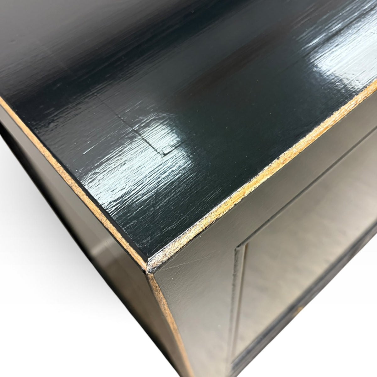 Close-up of Frano Sideboard black finish with distressed timber edge detail