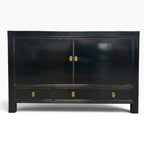 Frano Sideboard in black with two doors, three drawers and brass handles