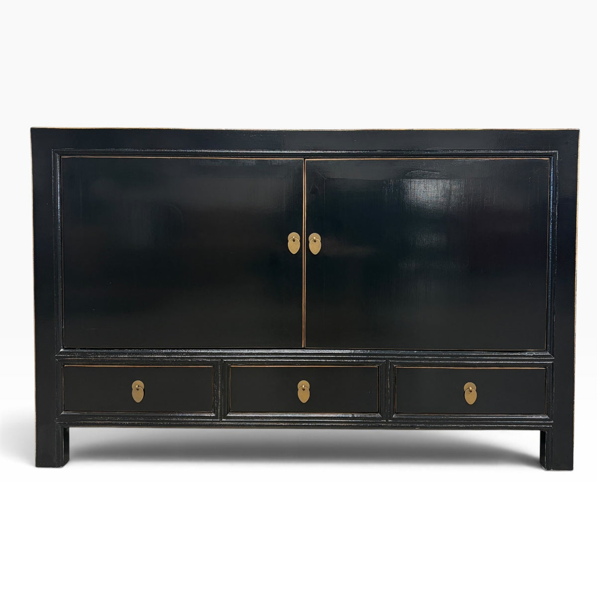 Frano Sideboard in black with two doors, three drawers and brass handles