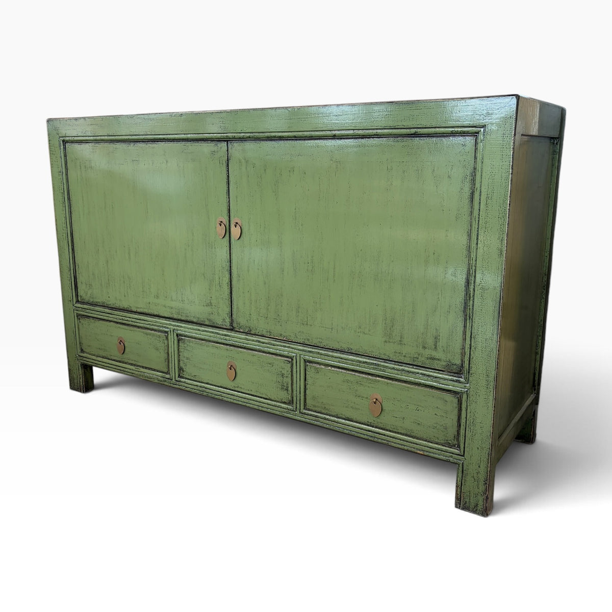 Angled view of Frano Sideboard in Olive showing its distressed finish and classic design