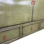 Close-up of Frano Sideboard showing brass-toned drop handles, drawers and aged olive finish
