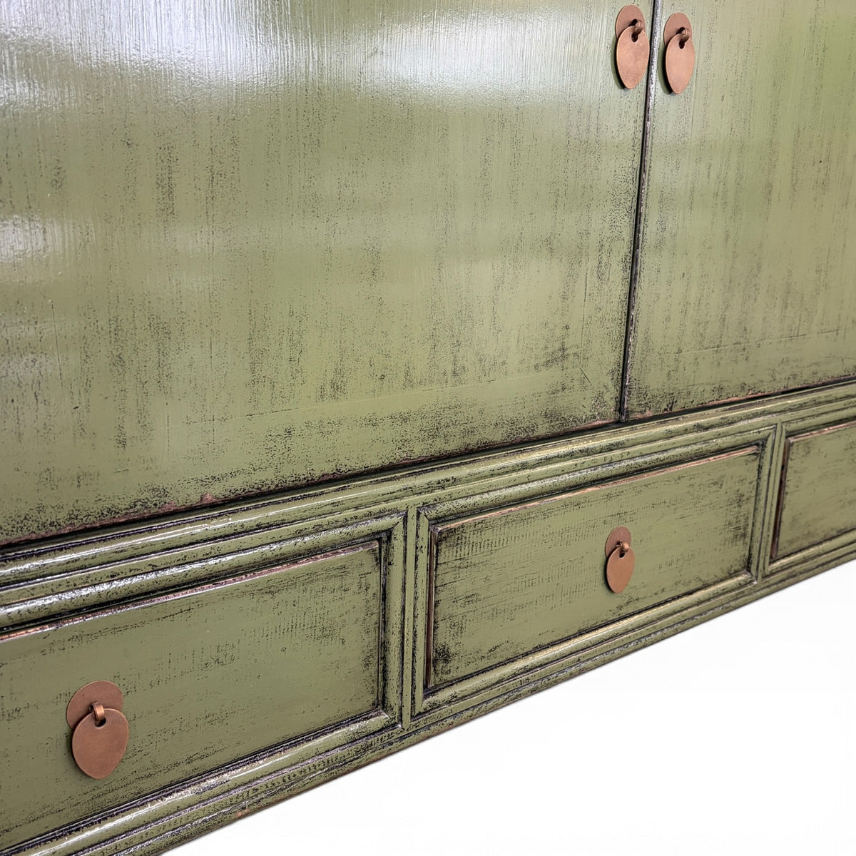 Close-up of Frano Sideboard showing brass-toned drop handles, drawers and aged olive finish