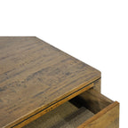 Close-up of the Hamstead Coffee Table showing the textured solid mango wood top and open drawer detail.