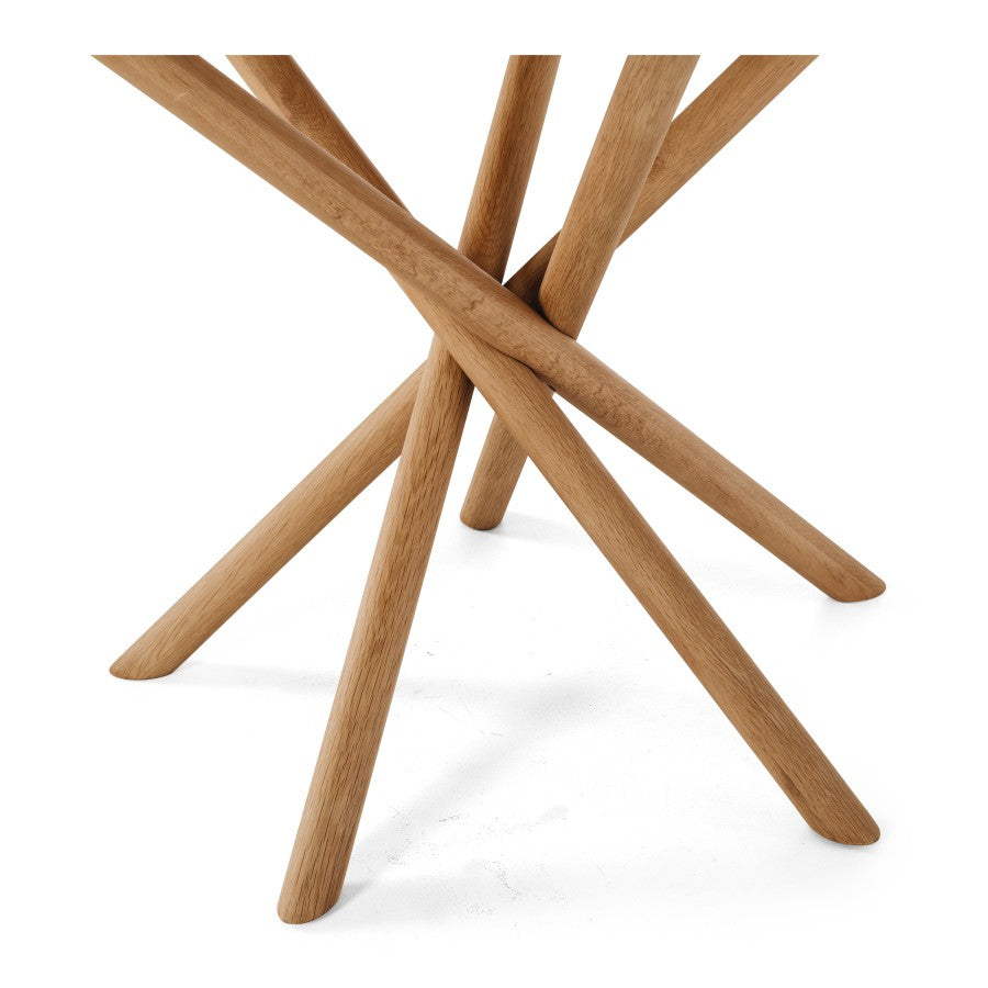 Close-up of the Harper Dining Table intersecting solid oak pedestal legs.